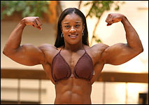 Kim Perez flexes her biceps